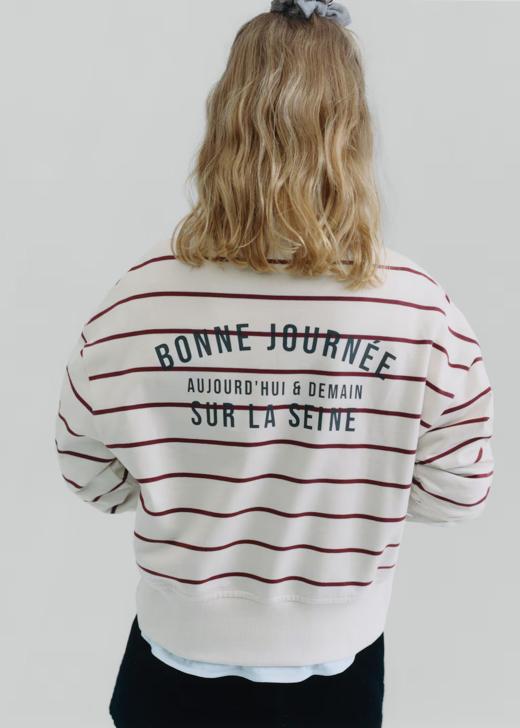 Striped sweatshirt with printed slogan
